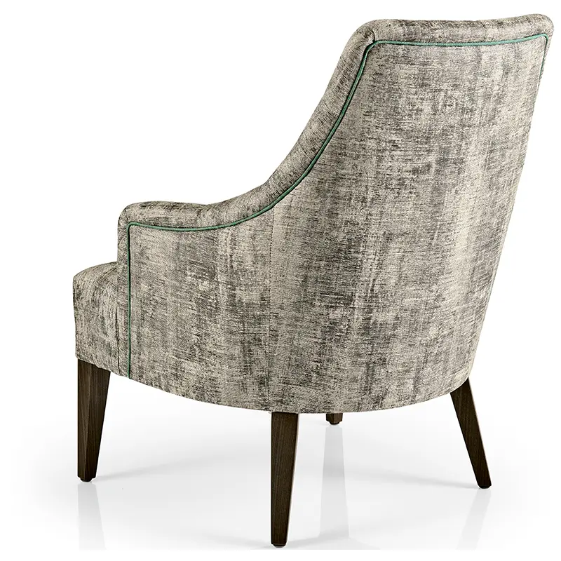 Hanna Sessel/Lounge von JMS – eleganter Loungesessel mit geschwungener Rückenlehne und grüner Ziernaht - Hantermann - Der Hotelausstatter Hanna Sessel/Lounge von JMS mit hoher Rückenlehne, grünem Keder und dunklen Holzbeinen für Hotel und Gastronomie