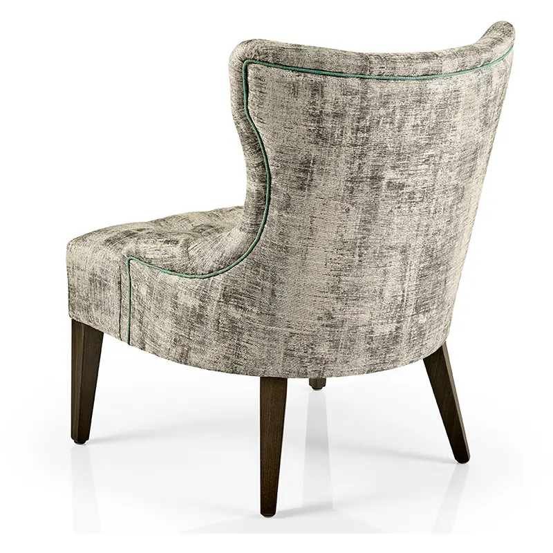 Hanna Sessel/Lounge von JMS – eleganter Loungesessel mit geschwungener Rückenlehne und grünem Keder - Hantermann - Der Hotelausstatter Hanna Sessel/Lounge von JMS mit geschwungener Rückenlehne, grünem Keder und Holzbeinen für Hotel und Gastronomie